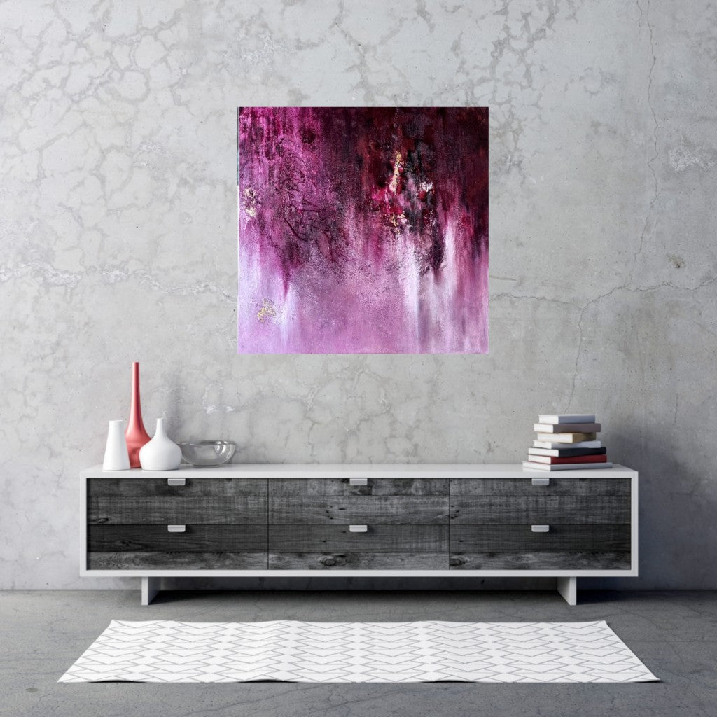 Abstract pink painting featured above low board in a clean-lined, contemporary space.