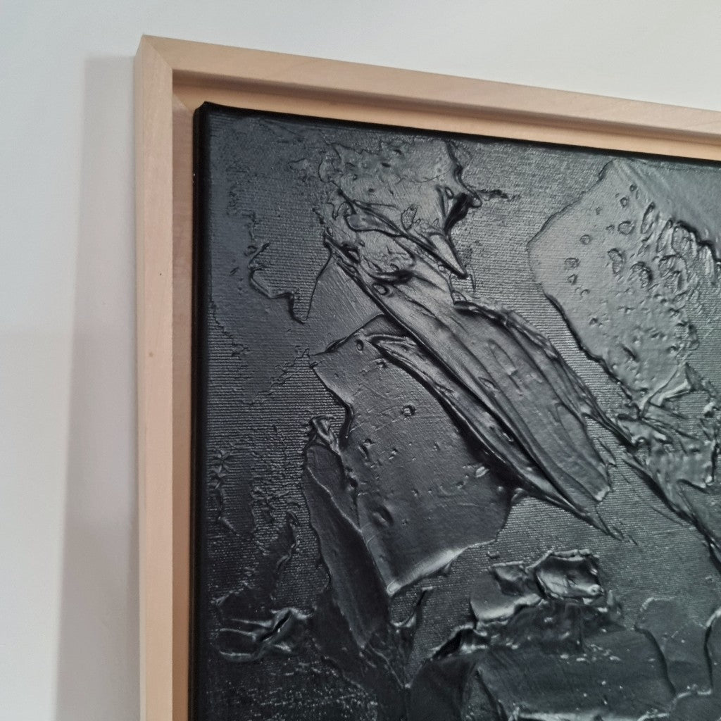 Black monochrome textured painting framed with wooden floating frames. Details.
