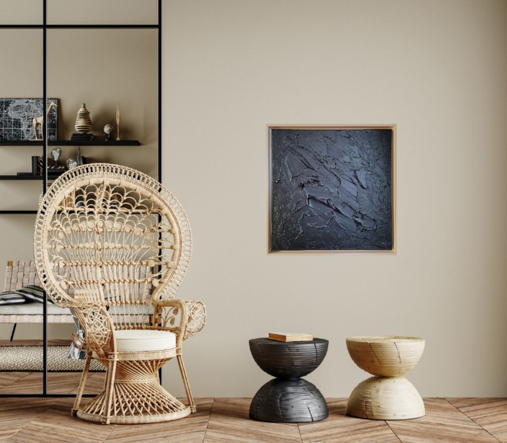 Black monochrome textured painting hanging in japandi-scandi home.